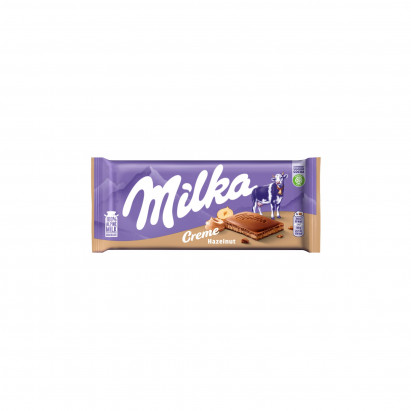 Milka Creme Czekolada mleczna z nadzieniem z orzechów laskowych 85 g